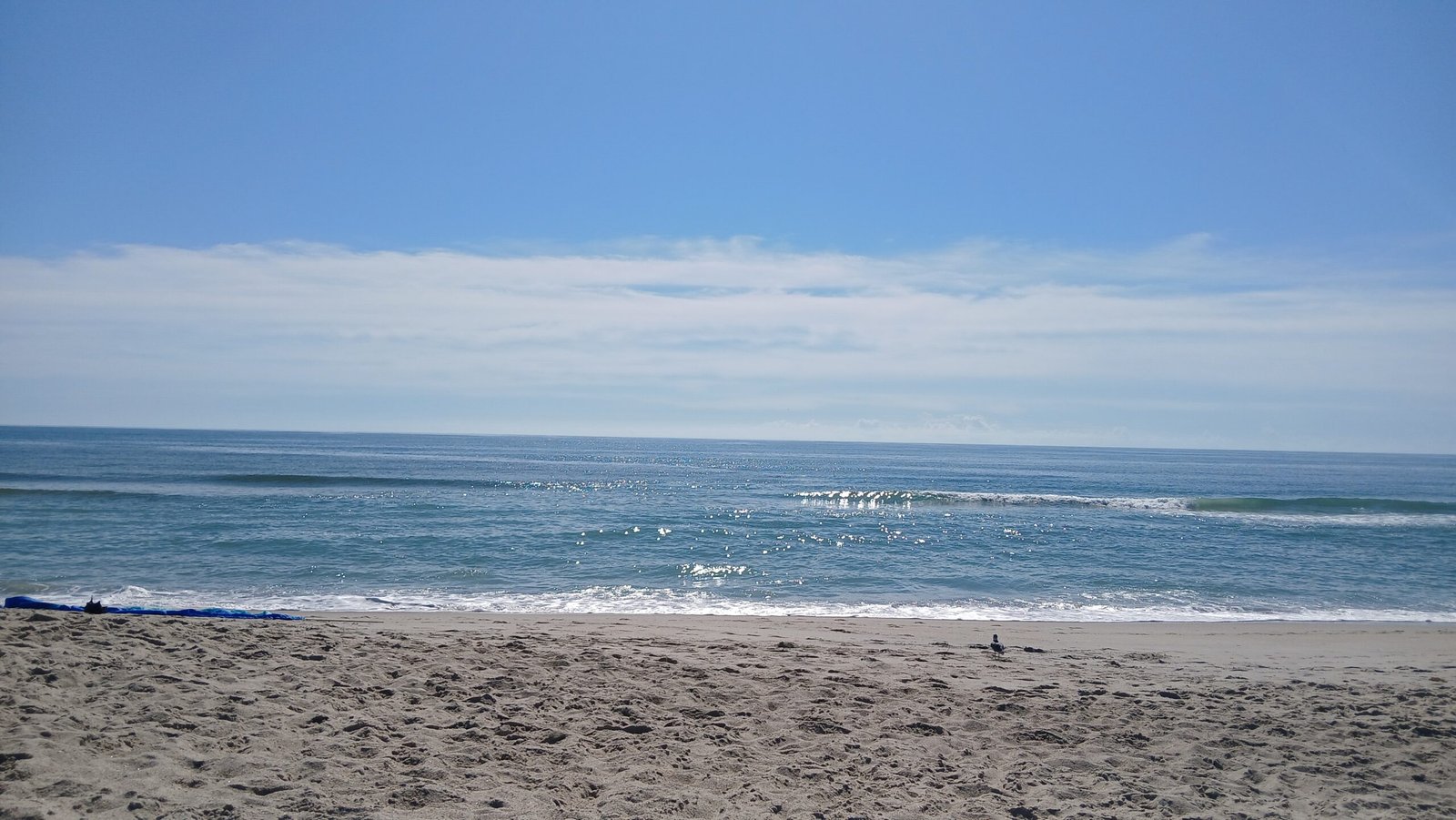 Waves crashing into a beach
