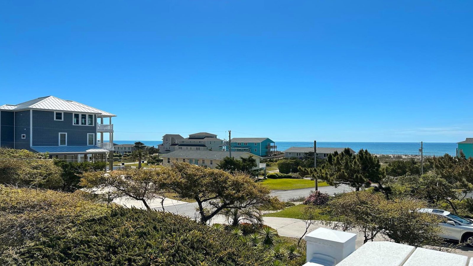 view of beach houses and the ocean in the distance