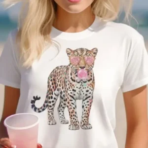 White t-shirt with cute leopard graphic wearing pink heart sunglasses and blowing bubblegum
