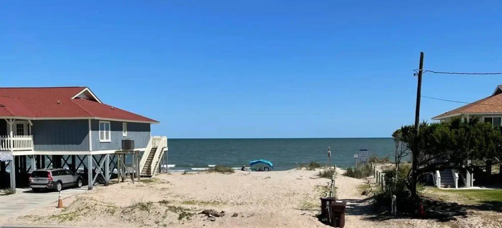 Edisto beach as seen between 2 cottages on the beachfront
