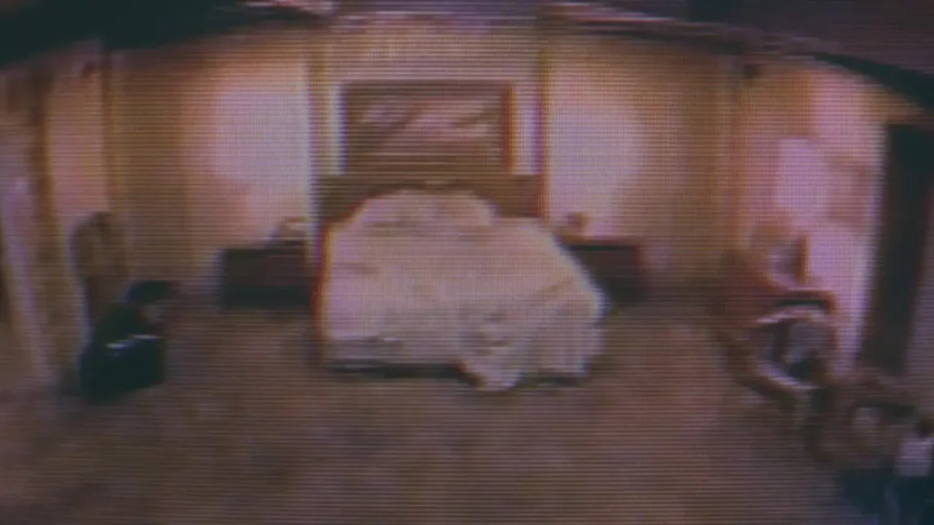 view of a bedroom from a hidden camera