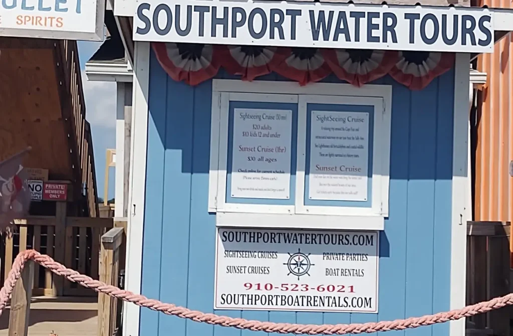 Signs on a building despicting southport water tours