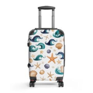 White hardshell spinner suitcase with colorful all-over print of ocean waves, starfish, and seashells on a white background