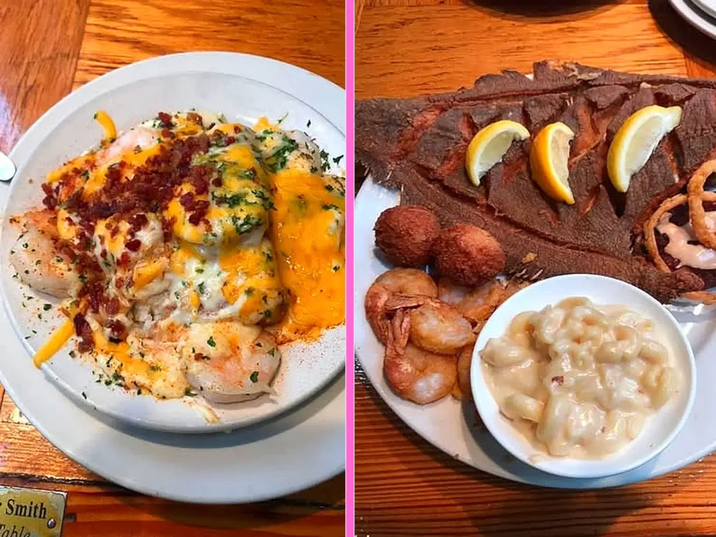 Side-by-side seafood dishes on a wooden table: Left, a white bowl filled with shrimp topped with melted orange cheese sauce, crispy bacon bits, and fresh herbs. Right, a whole fried fish platter with lemon wedges, fried shrimp, hush puppies, and a side of creamy macaroni and cheese.