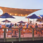 Dockside dining at dusk with shrimp boats at Hudson's Seafood House on the Docks, Hilton Head
