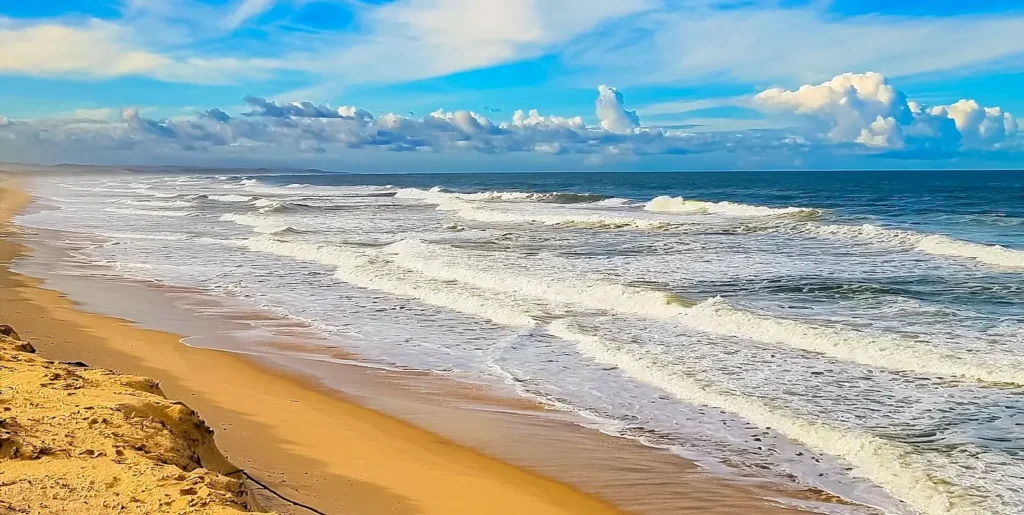 Waves rolling onto a sandy beach along the North Carolina coast near the Outer Banks