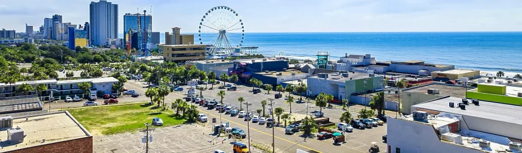 Aerial view of Myrtle Beach skyline, SkyWheel, and oceanfront traffic corridor