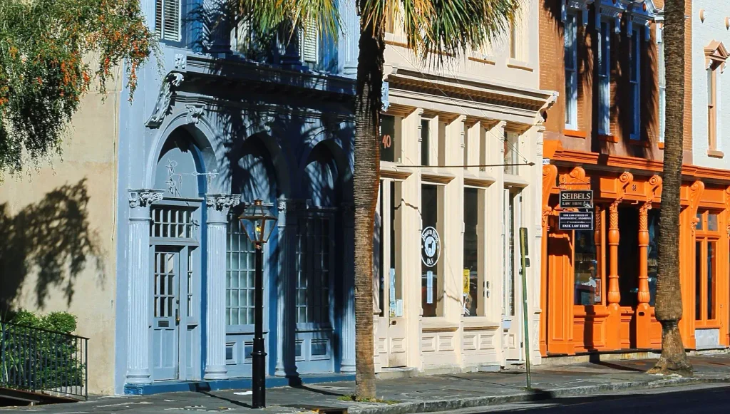 Colorful historic building facades along a Charleston street