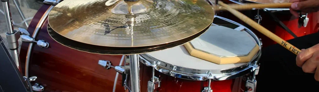 Drummer's cymbal and snare drum close-up during a live jazz festival set